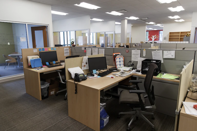Cubicles and desks in an office building.