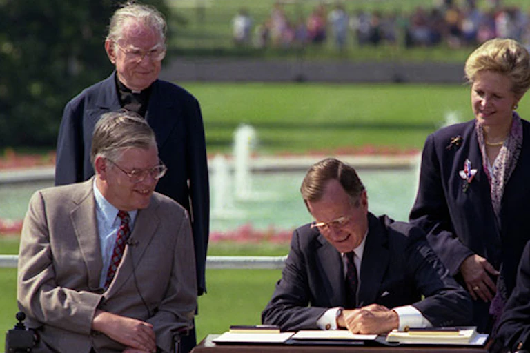 George H.W. Bush signs the ADA into law.
