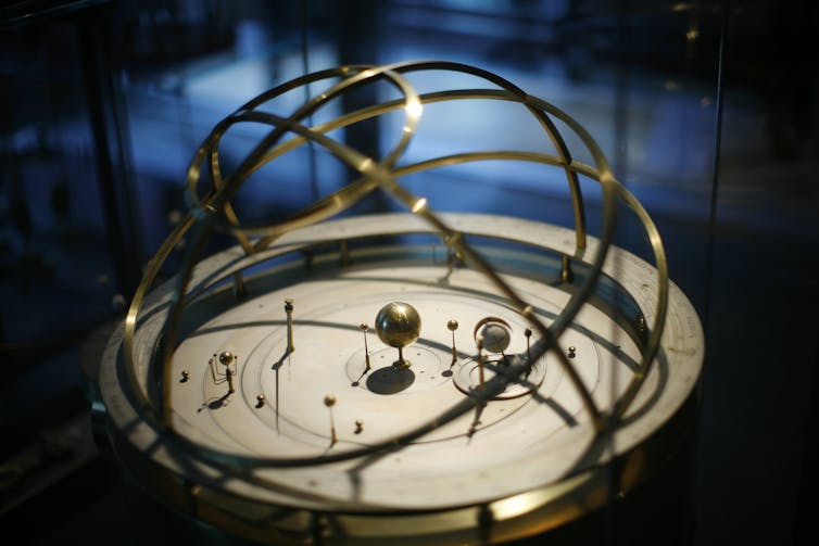 Orreries became more common throughout the 18th century as models of the solar system, but none had been built yet at the time the portrait was painted. Dina Rudick/The Boston Globe via Getty Images