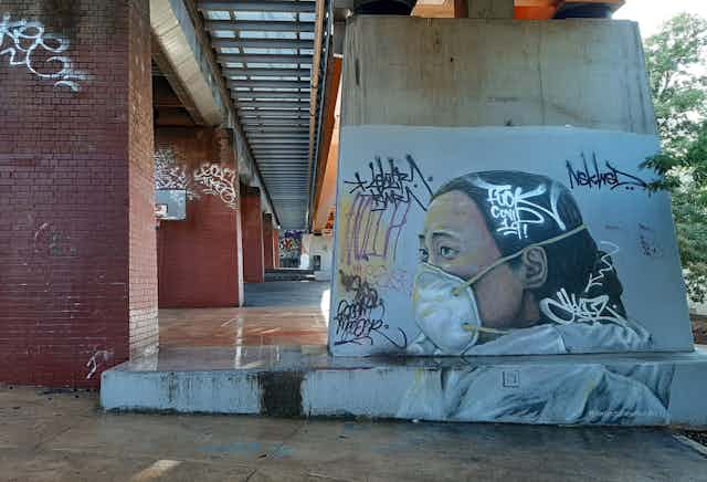 Mural on railway underpass in Northcote, Melbourne, depicting Ai Fen, the Wuhan doctor who was reprimanded for raising the alarm about COVID-19.