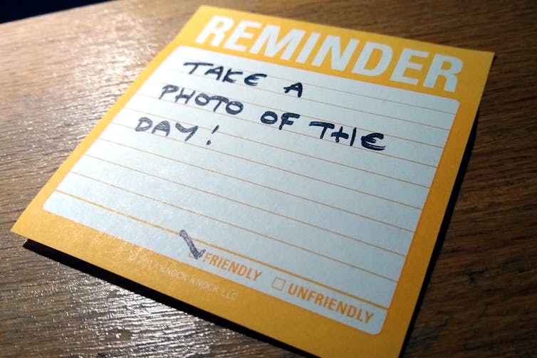 A written note to remind you to take a photo each day