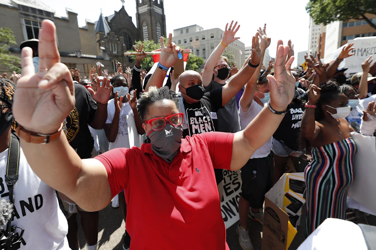 Hundreds of protesters respond during a rally and march in downtown Jackson, Miss., in response to the death of George Floyd.