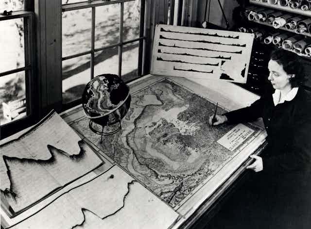 Marie Tharp at work drafting a map at her desk