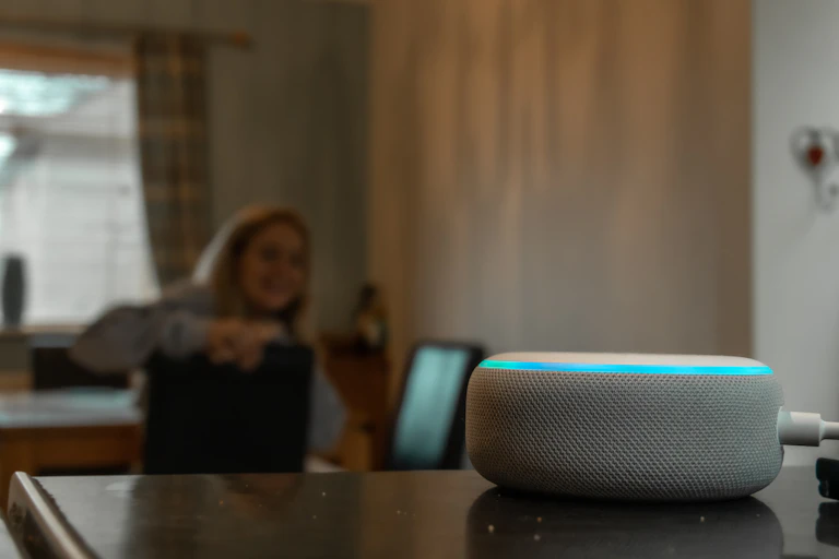 Woman talking to Amazon Alexa artificial intelligence assistant