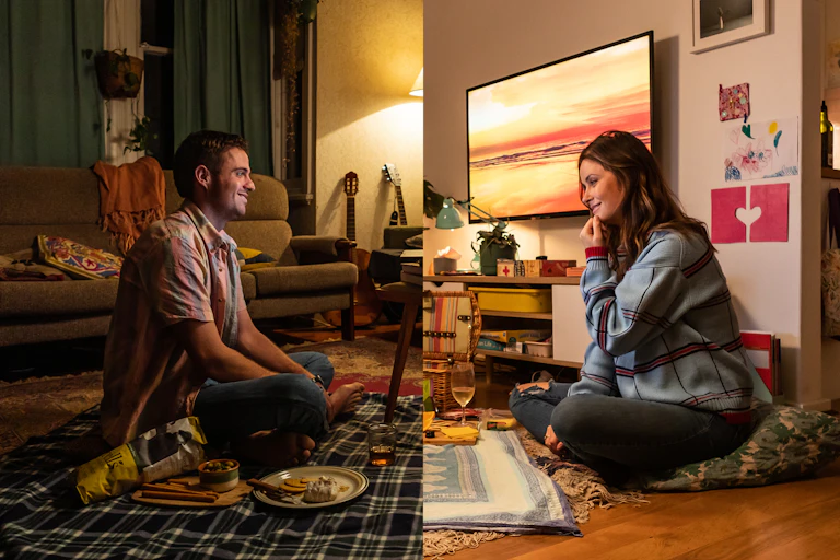 Split screen of two houses: a man and a woman look like they are picnicking together.