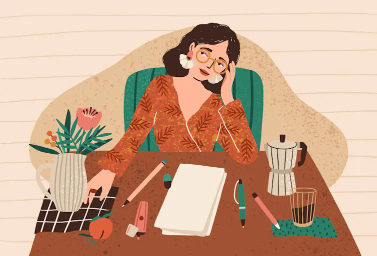 Young pensive woman sitting at desk.