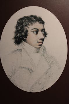 A painting of the Black composer George Bridgetower in an oval frame.