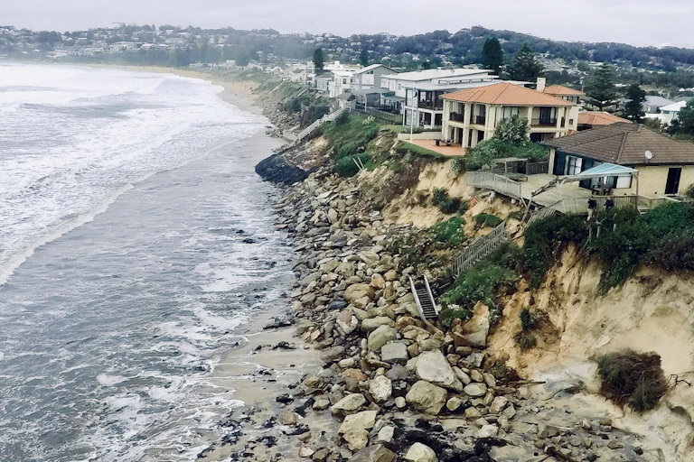 Homes at Wamberal teetering on an eroded cliff face