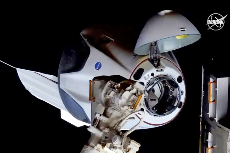 Picture of Crew dragon docking with the International Space Station.