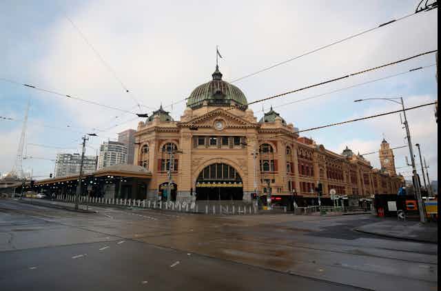 Deserted street in front of Melbourne's Flinders Street Station.