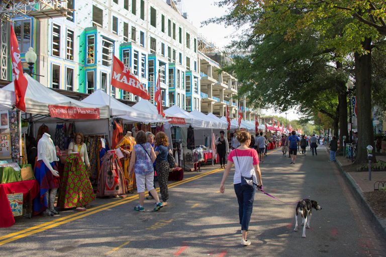 Street stalls next to an apartment building and facing onto a pedestrian-only street.