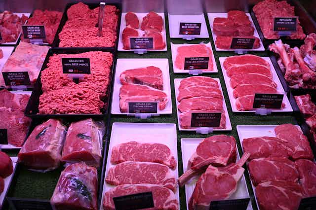 Meat cuts displayed in butcher shop.