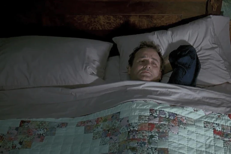 Sad man in bed