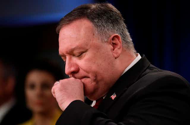 US Secretary of State Mike Pompeo clears his throat at a news conference at the State Department in Washington, DC on April 7, 2020.