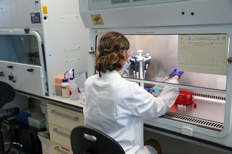 Scientist in white coat in laboratory