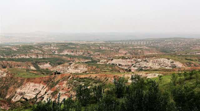 Landscape of eroded rocky hills.