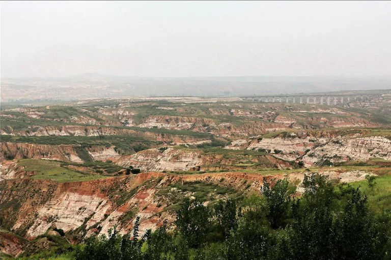 Landscape of eroded rocky hills.