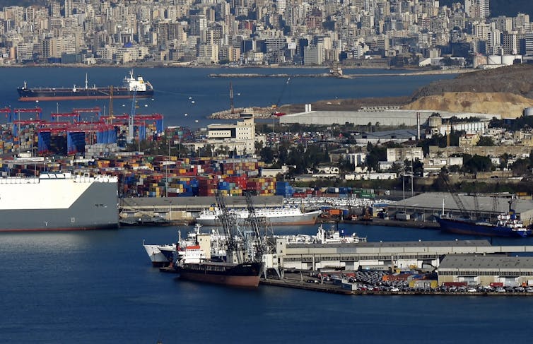 Photograph showing ships and the port at Beirut with the city in the background.
