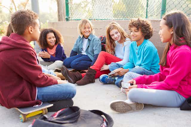 Picture of a group of children talking.