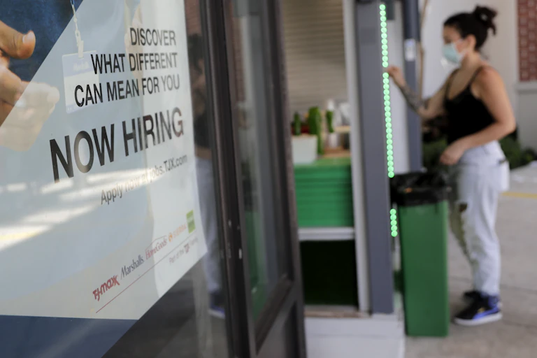A Marshalls retail store displays a Now Hiring sign during the new coronavirus pandemic.