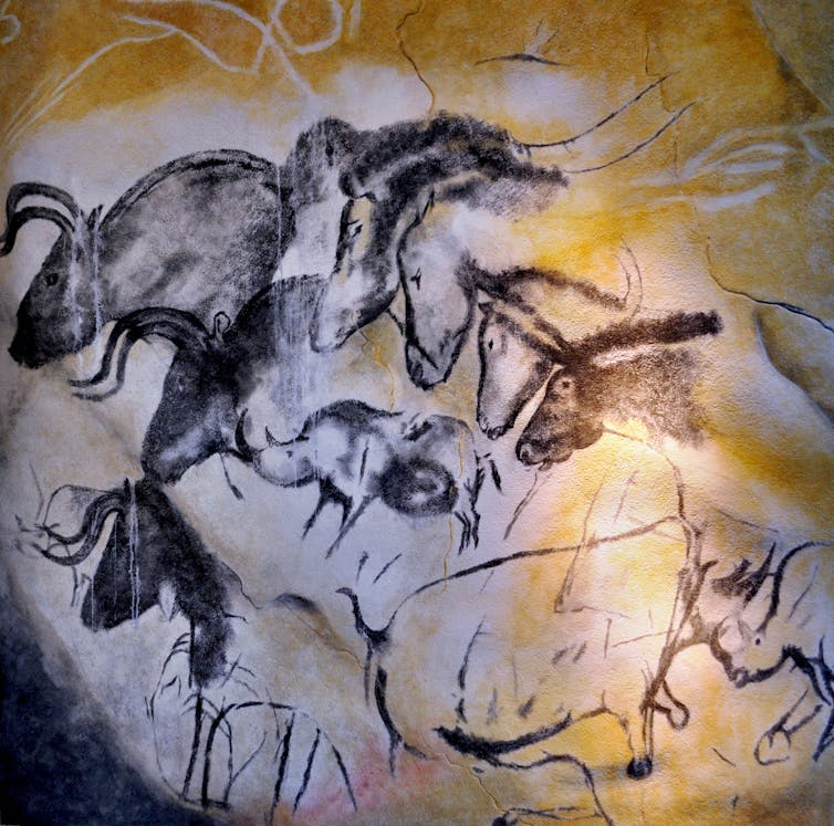 Chauvet cave paintings depicting wild animals including horses.