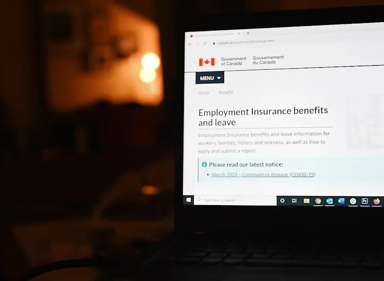 An employment insurance form on a laptop.