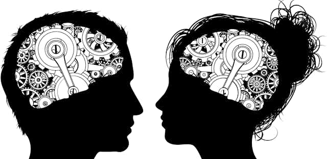 Silhouettes of a male and female head facing each other with brains made of cogs