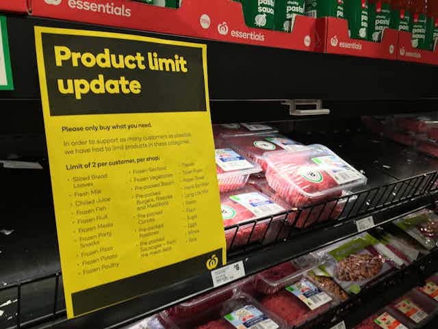 A supermarket meat section, with a sign reading 'Product limit update'