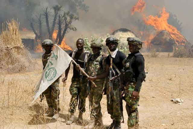 Nigerian soldiers are seen after an operation against Boko Haram terrorists at a terrorist camp in Borno State, Nigeria