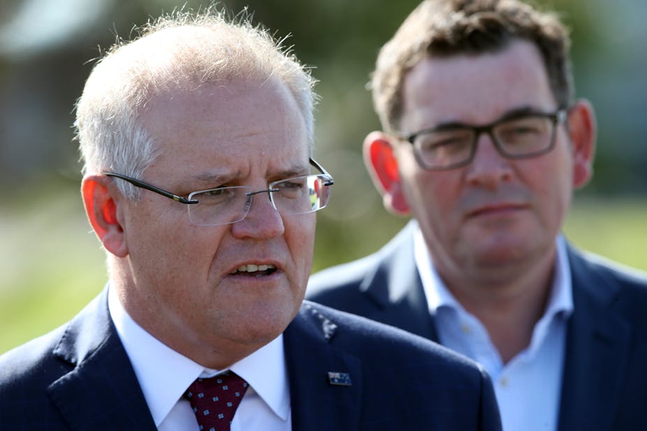 Prime Minister Scott Morrison stands with Victorian Premier Daniel Andrews.