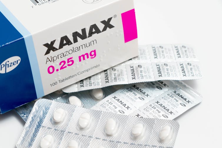 A Xanax box and tablets.