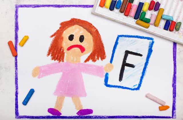 Child's drawing of sad little girl holding up an F grade