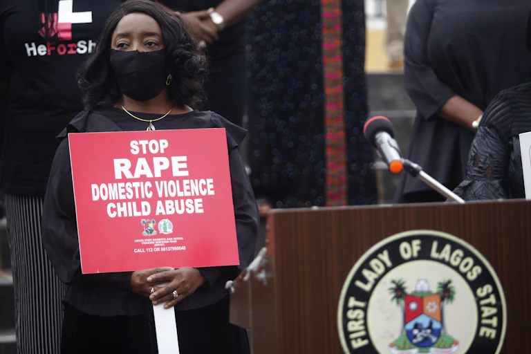 Woman holds poster