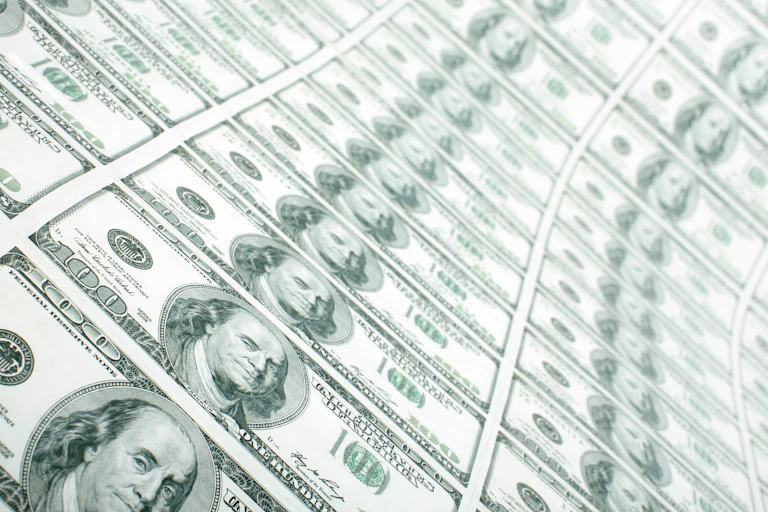 A sheet of $100 bills printed out.