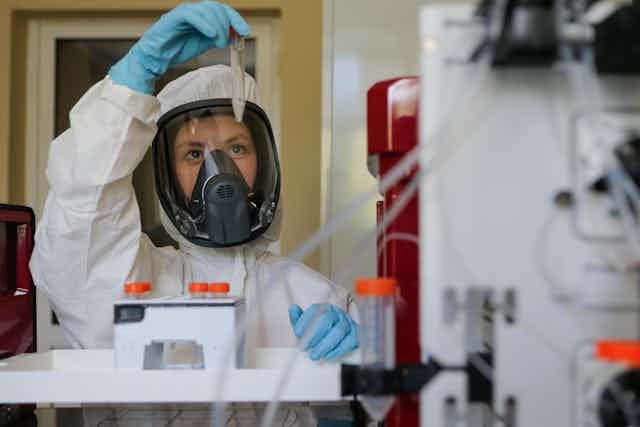 A scientist holding a coronavirus vaccine