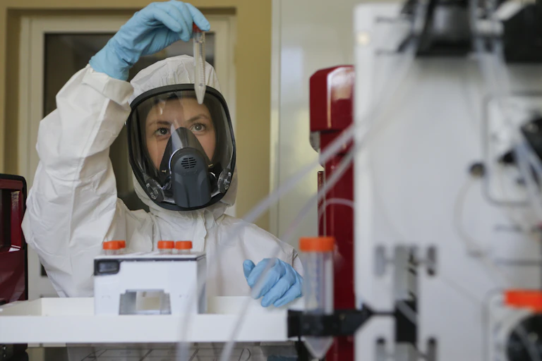 A scientist holding a coronavirus vaccine