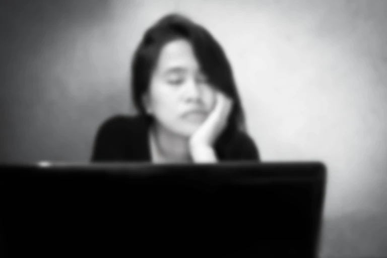 Worried student sitting in front of ptop
