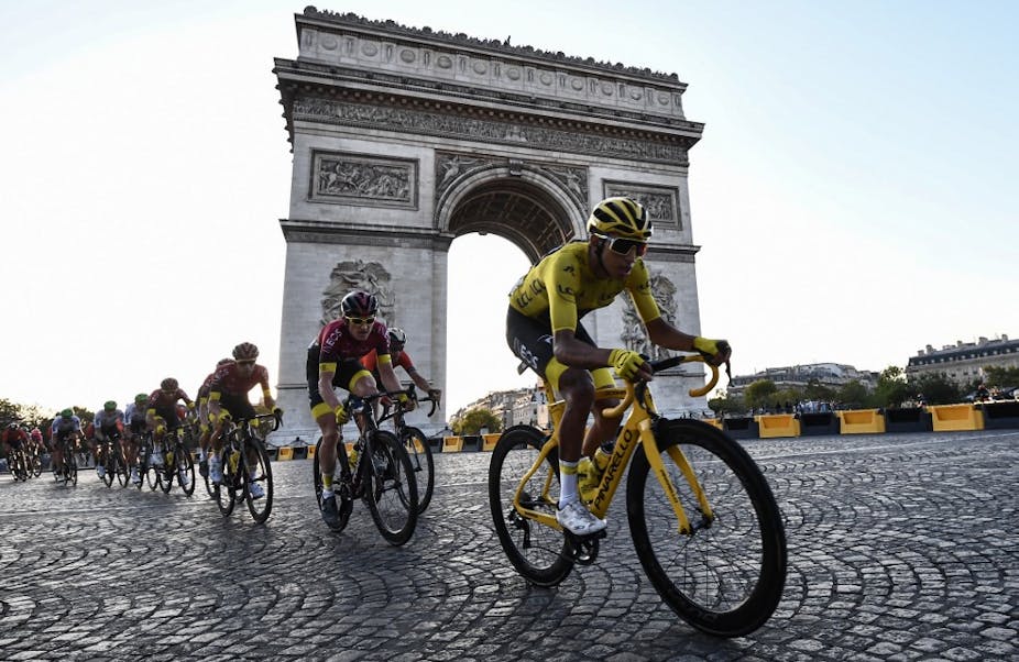 Cyclists by the Arc de Triomphe in Paris.
