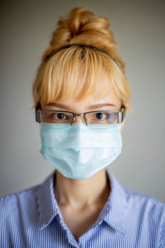 Woman wearing face mask and goggles