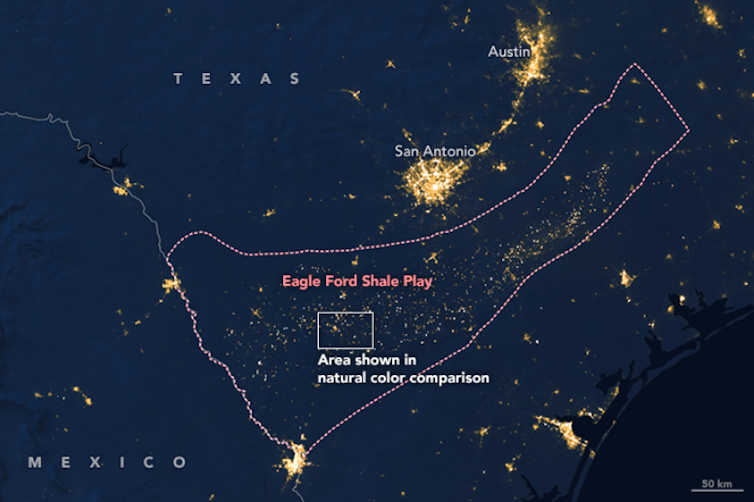 A satellite view of Texas at night shows gas flaring in the Eagle Ford shale region.