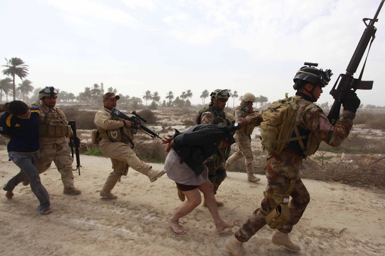 Iraqi security forces arresting suspected Islamic State militants