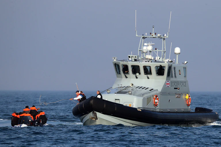 Border Force vessel intercepting dinghy with asylum seekers.