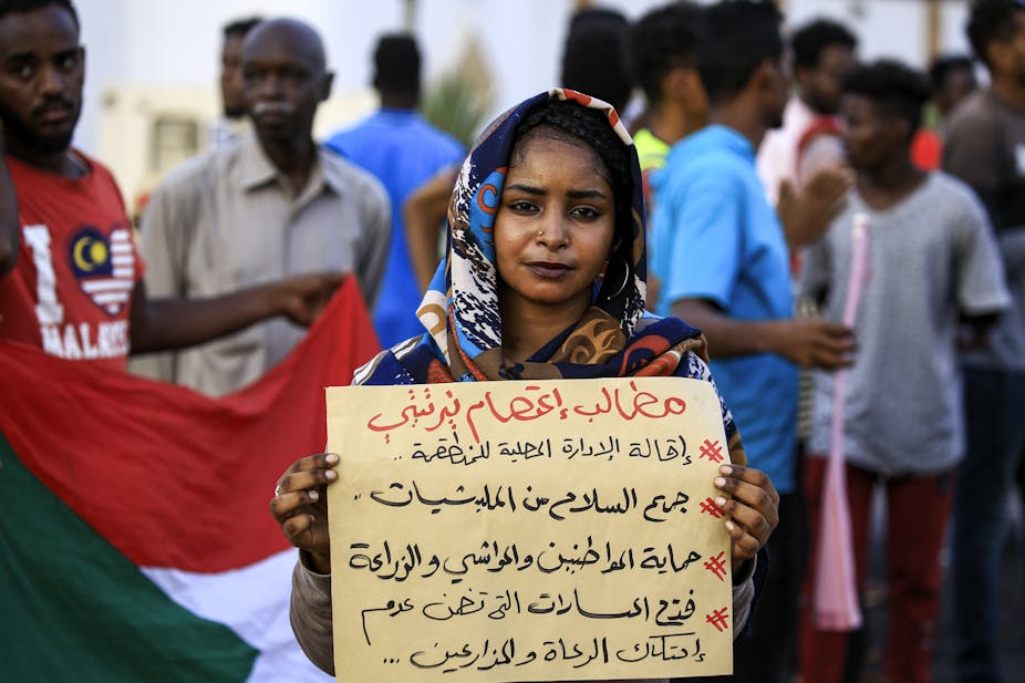 Woman holding a placard at a demonstration