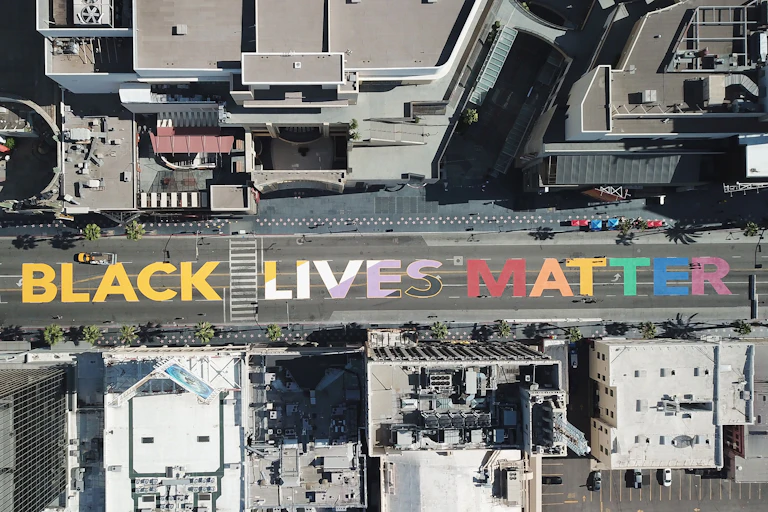 The words "All Black Lives Matter" are seen painted on Hollywood Boulevard in California.