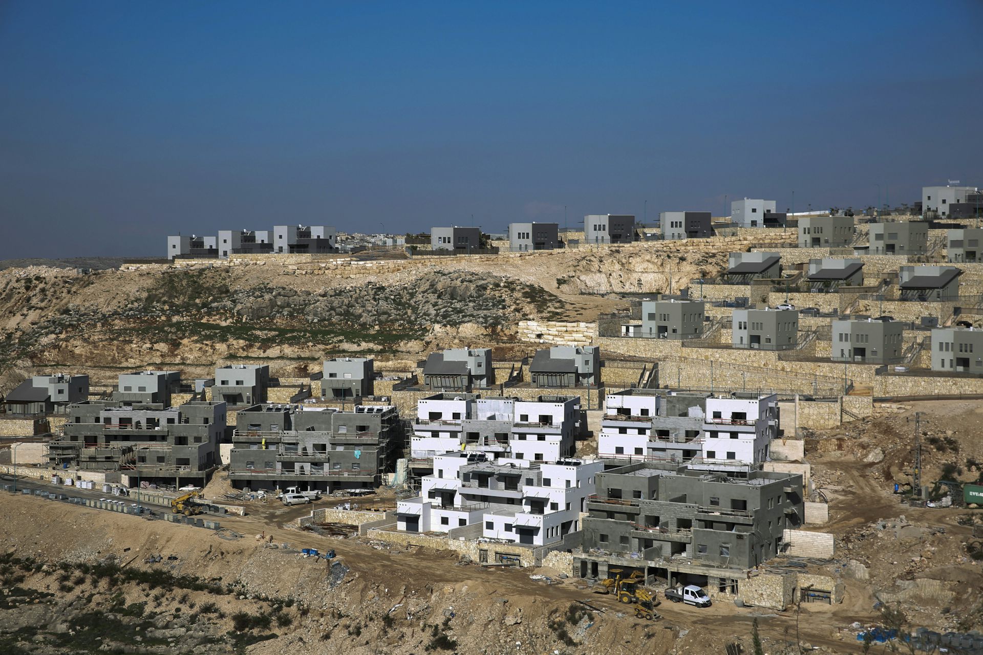 Israel suspends formal annexation of the West Bank, but its controversial settlements continue