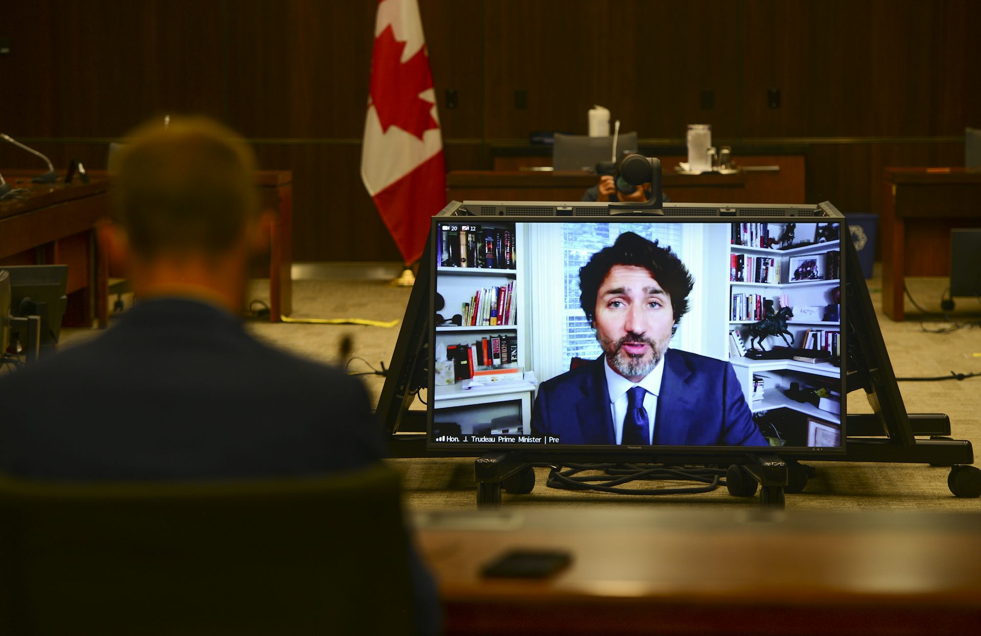 Prime Minister Justin Trudeau appears on a screen