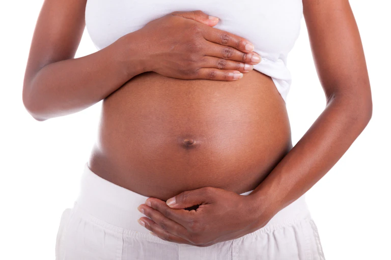Pregant women holding stomach