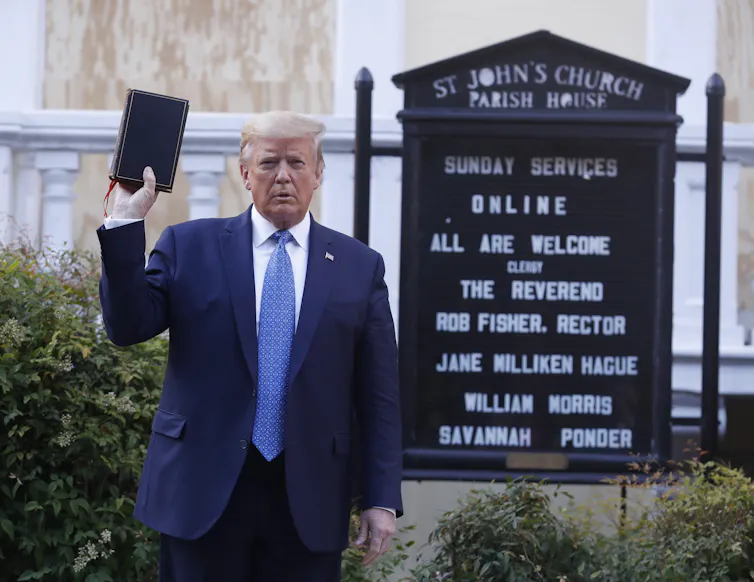 Donald Trump holding a Bible outside a church in Washington DC