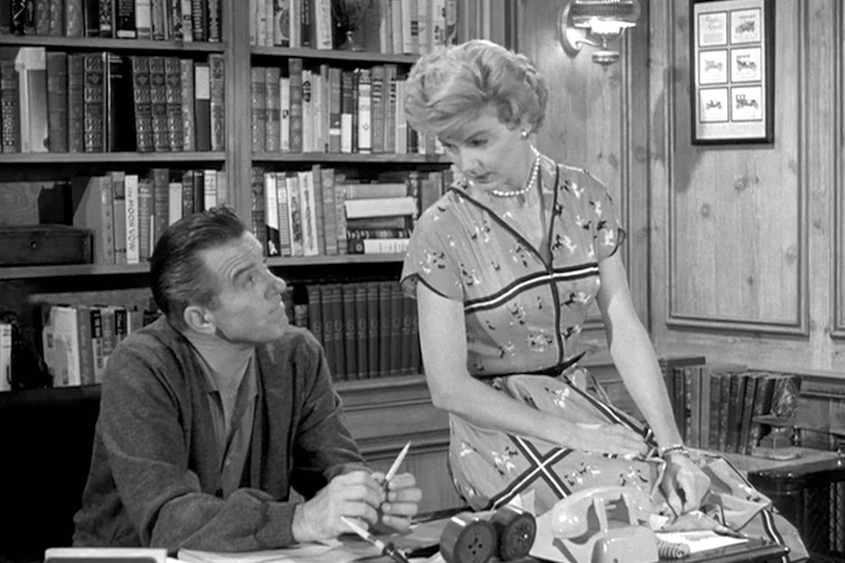 'Leave It to Beaver' character June Cleaver sits on the desk of her husband, Ward Cleaver.