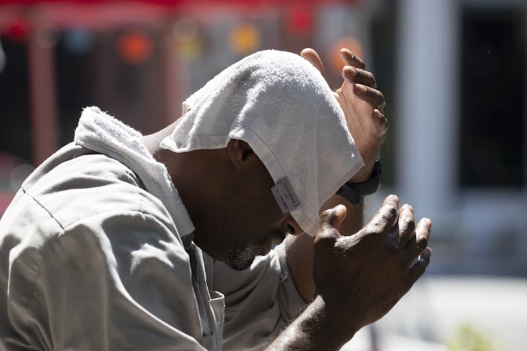 Man cooling off in heat wave